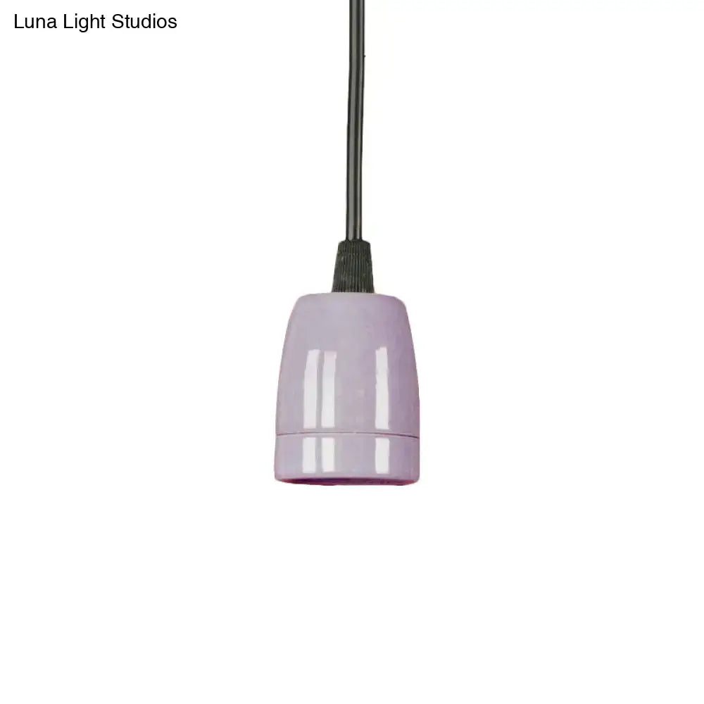 A sleek lavender ceramic pendant light with a glossy finish and black cord from decorbites black red ceramic collection