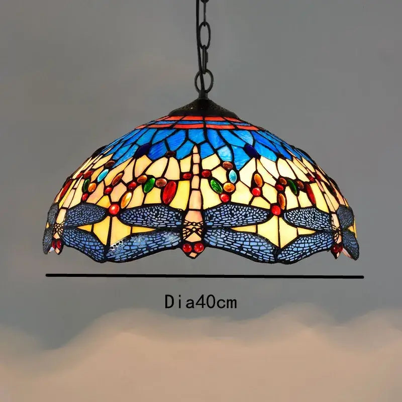 Retro Tiffany style colorful glass chandelier featuring a vibrant stained glass dragonfly pendant light with mosaic patterns