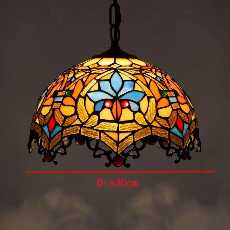 A retro tiffany style colorful glass chandelier pendant with vibrant stained glass and black metalwork for dining room decorbites colorful glass