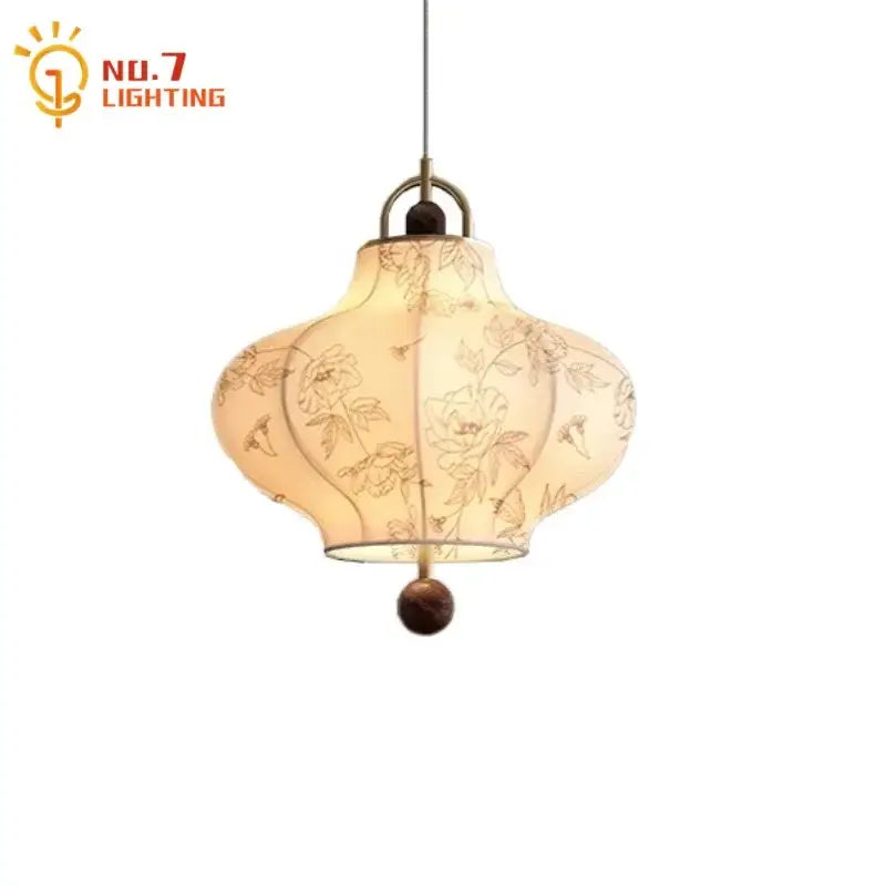 Cream fabric retro pendant lights with intricate floral embroidery and dark wooden finial by decorbites wabi-sabi for bedroom decor