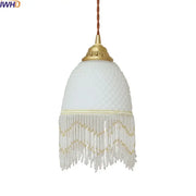 A delicate white frosted glass tassels led pendant light with gold metal top and clear beaded fringe for dining room decorbites