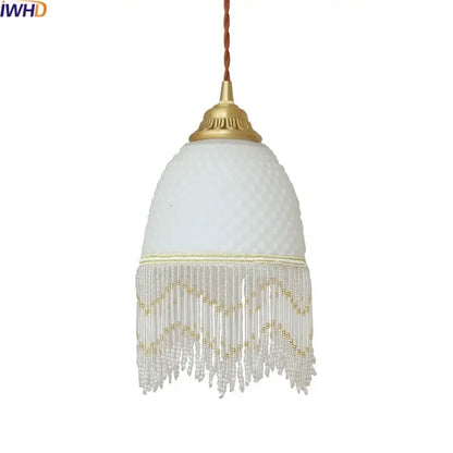 A delicate white frosted glass tassels led pendant light with gold metal top and clear beaded fringe for dining room decorbites