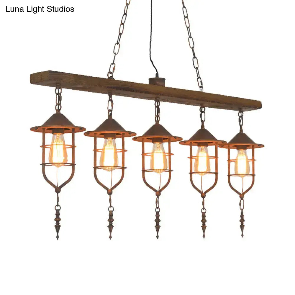 Rustic wooden beam ceiling light with five wrought iron cage lanterns and exposed filament bulbs for dining room lighting fixture
