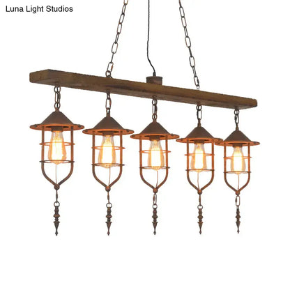 Rustic wooden beam ceiling light with five wrought iron cage lanterns and exposed filament bulbs for dining room lighting fixture