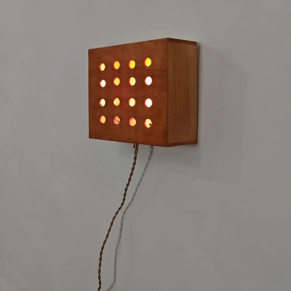 Warm-toned wooden cave box retro wall light with circular illuminated holes for bedroom decorbites cave box lighting