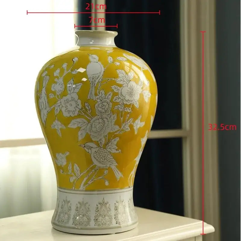 Retro yellow and white porcelain vase with intricate floral and bird motifs, glossy finish, ideal for living room decor
