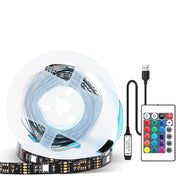 Rgb bluetooth led strip lights with black circuit board and blue backlighting on clear spool with remote control