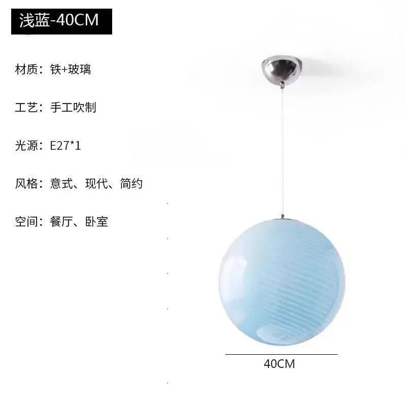 A 40cm spherical glass pendant light with pale blue ribbed shade and chrome fixture for dining room lighting