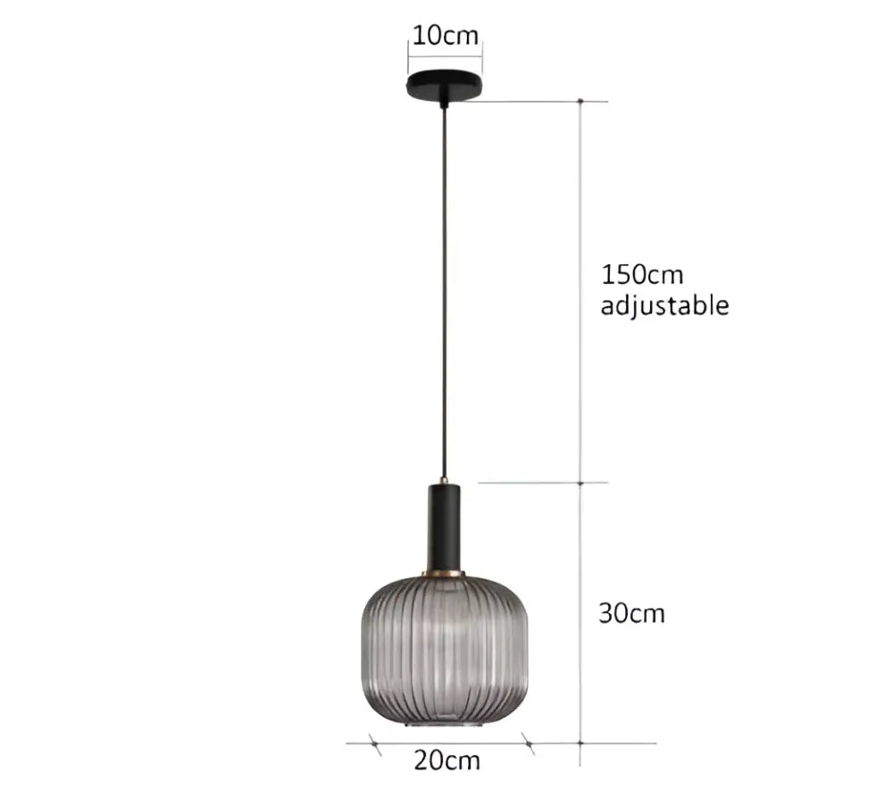 A modern pendant light with a ribbed translucent gray glass shade and black metal rod for dining room decorbites colorful glass