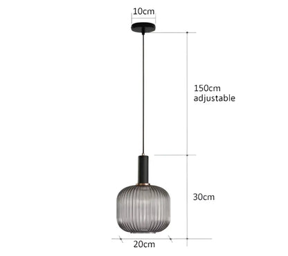 A modern pendant light with a ribbed translucent gray glass shade and black metal rod for dining room decorbites colorful glass