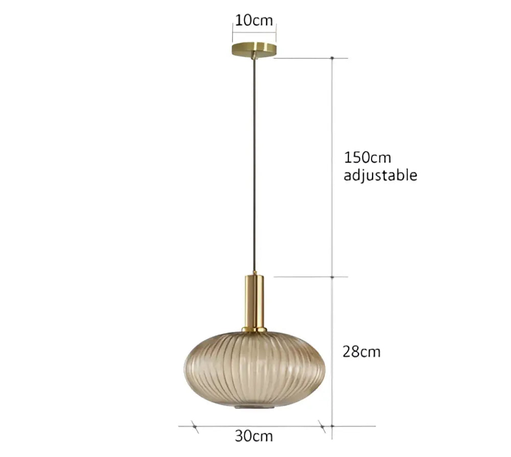 A modern pendant light with a gold-toned metal fixture and ribbed amber glass shade perfect for dining room decorbites colorful glass pendant lights