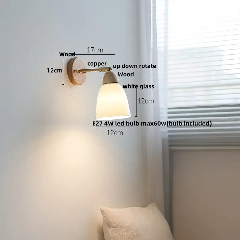 Minimalist wall sconce light with copper metal arm, wooden base, and white glass diffuser for bedroom use