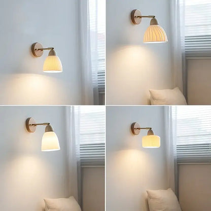 Warm-toned wall sconce light with wooden base brass arm and ribbed ceramic shade for bedroom wall sconce use