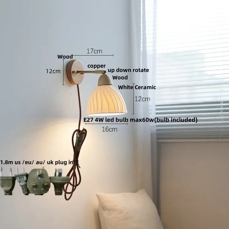 White ribbed ceramic and wood wall sconce light with fluted bell-shaped shade for bedroom use