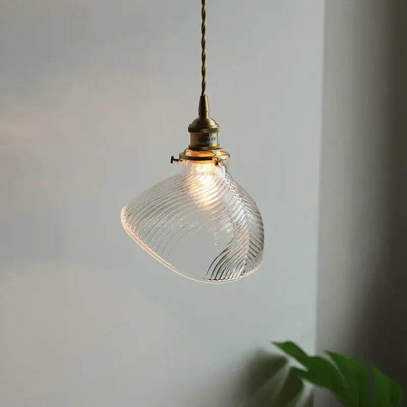 Ribbed clear glass led pendant light with brass hardware for dining room featuring decorbites clear glass design
