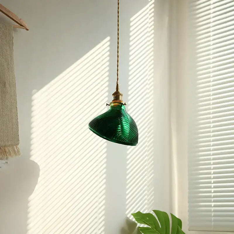 Vintage-style green ribbed clear glass led pendant light with brass hardware hanging from twisted cord for dining room decorbites clear glass