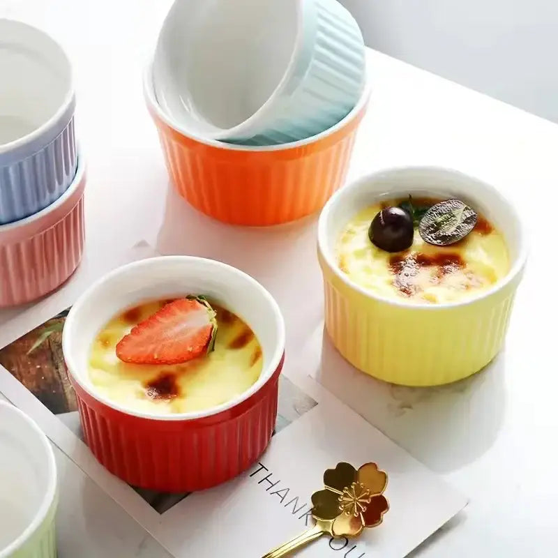 Pastel-colored ribbed decorbites ceramic baking bowl set with creamy dessert and fruit, ideal as ceramic baking ramekins