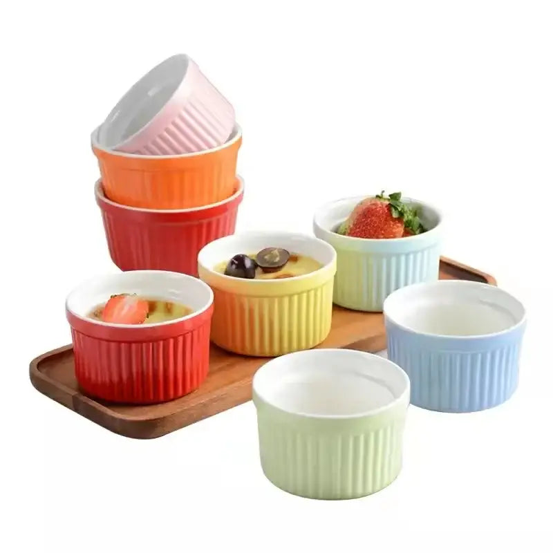 Set of colorful ribbed decorbites ceramic baking bowls in pastel and vibrant hues for individual dessert serving