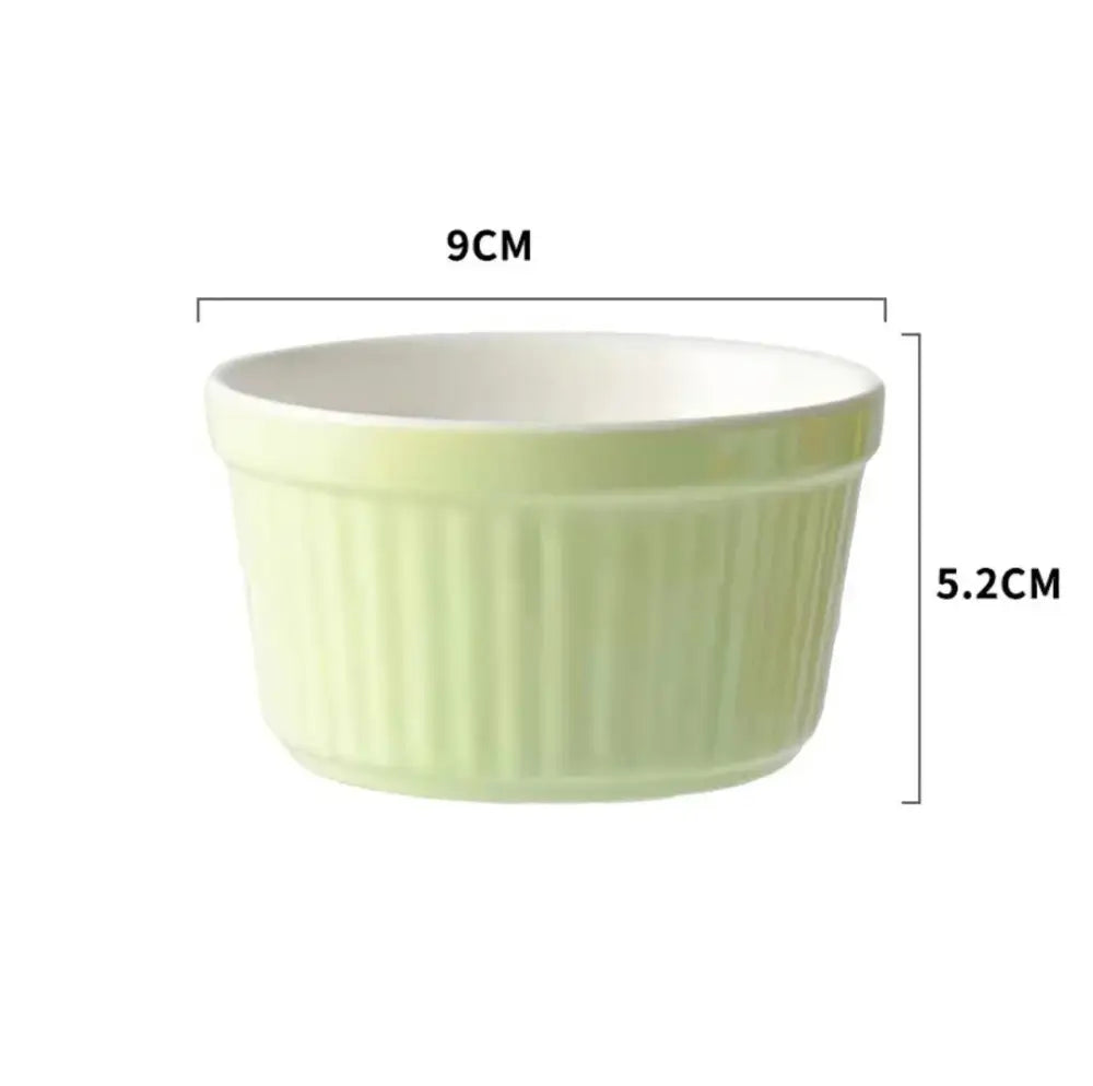 A pale green ribbed ceramic baking bowl with smooth white interior from decorbites ceramic baking ramekin set