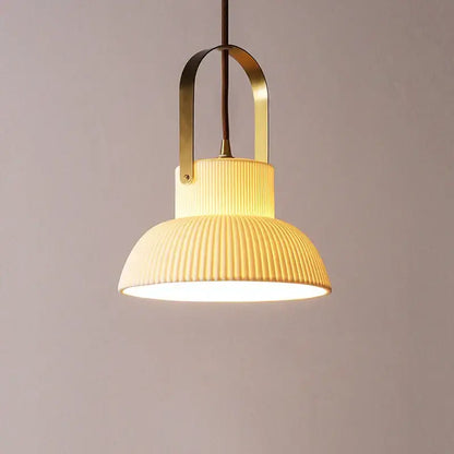 Cream-colored ribbed ceramic led pendant light with brass-finished metal frame for kitchen decorbites ceramic led pendant