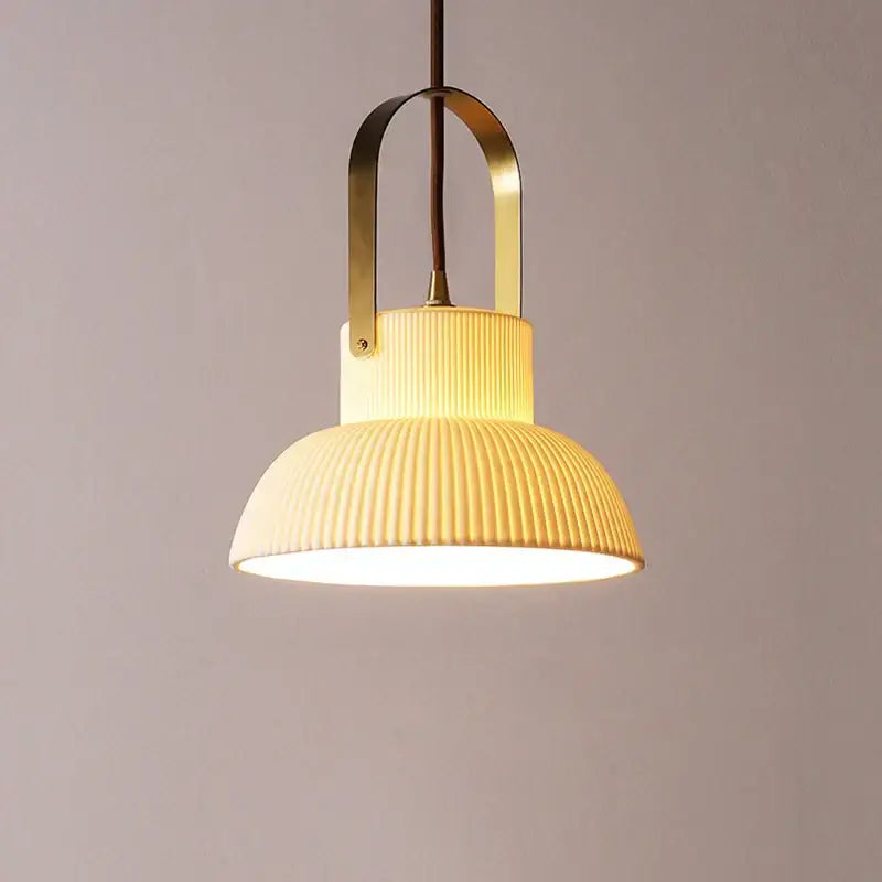 Cream-colored ribbed ceramic led pendant light with brass-finished metal frame for kitchen decorbites ceramic led pendant