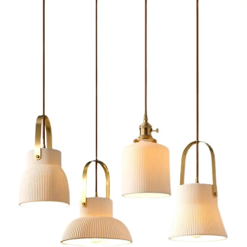 Four cream-colored ribbed ceramic led pendant lights with brass hardware for kitchen decorbites ceramic led pendant decor