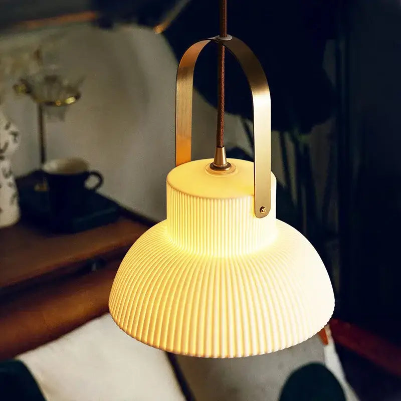 Warm-toned ribbed cream ceramic led pendant light with brass handle for kitchen decorbites ceramic led pendant lighting