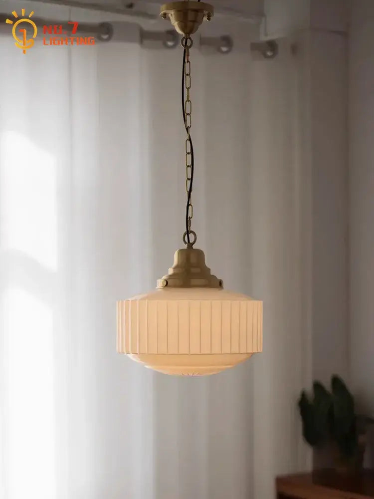 Vintage-style ribbed cream glass and brass pendant light with metal frame hanging from chain for dining room decorbites brass glass pendant