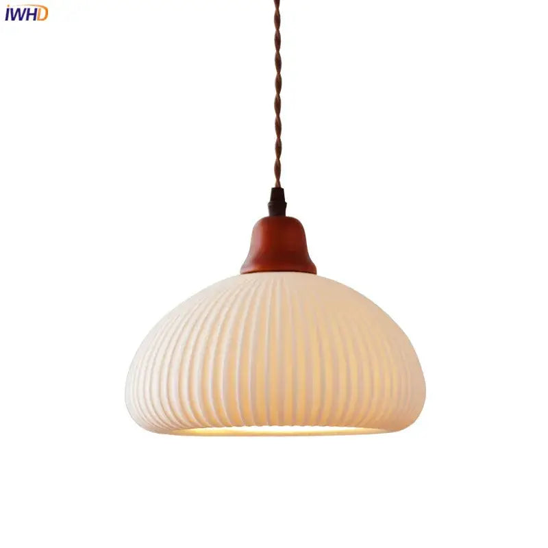 Cream-colored ribbed glass pendant light with warm wood top and twisted cord ideal for dining room decorbites ceramic led