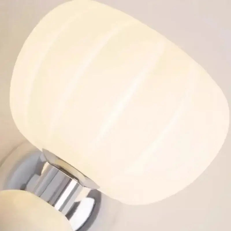 Cream breeze pumpkin ribbed cream glass wall lamp with polished chrome base for bedroom lighting by decorbites cream breeze