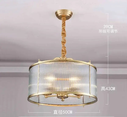 Gold-toned decorbites glass chandelier with ribbed cylindrical glass shade and twisted brass chain for living room pendant light