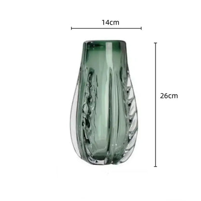 A sleek 26cm translucent green decorbites crystal vase with fluted teardrop shape and vertical ridges for living room decor