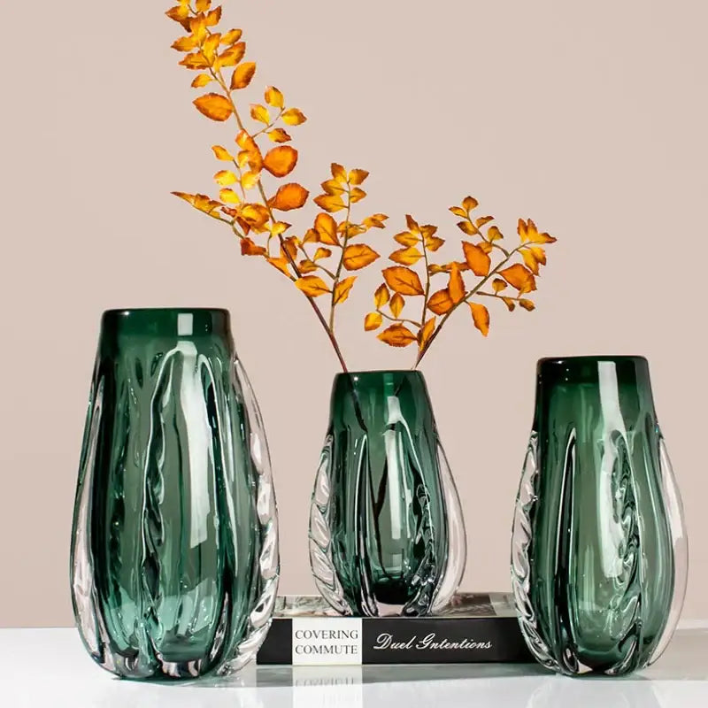 Three elegant emerald green ribbed decorbites crystal vases with clear glass accents for living room decor
