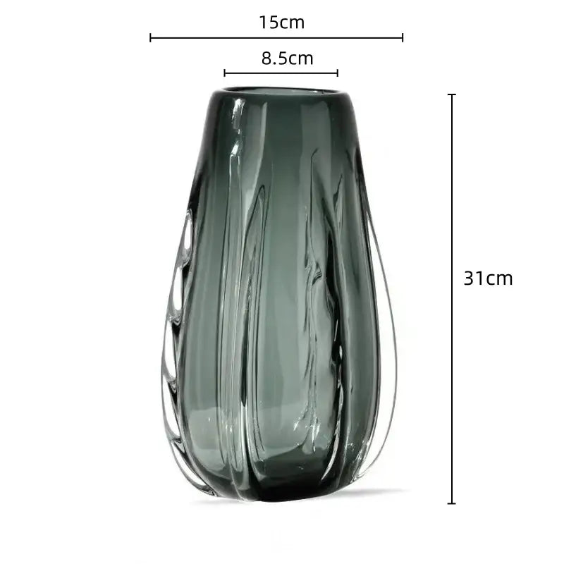 A sleek dark gray glass decorbites crystal vase with ribbed texture and elegant curves for living room decor