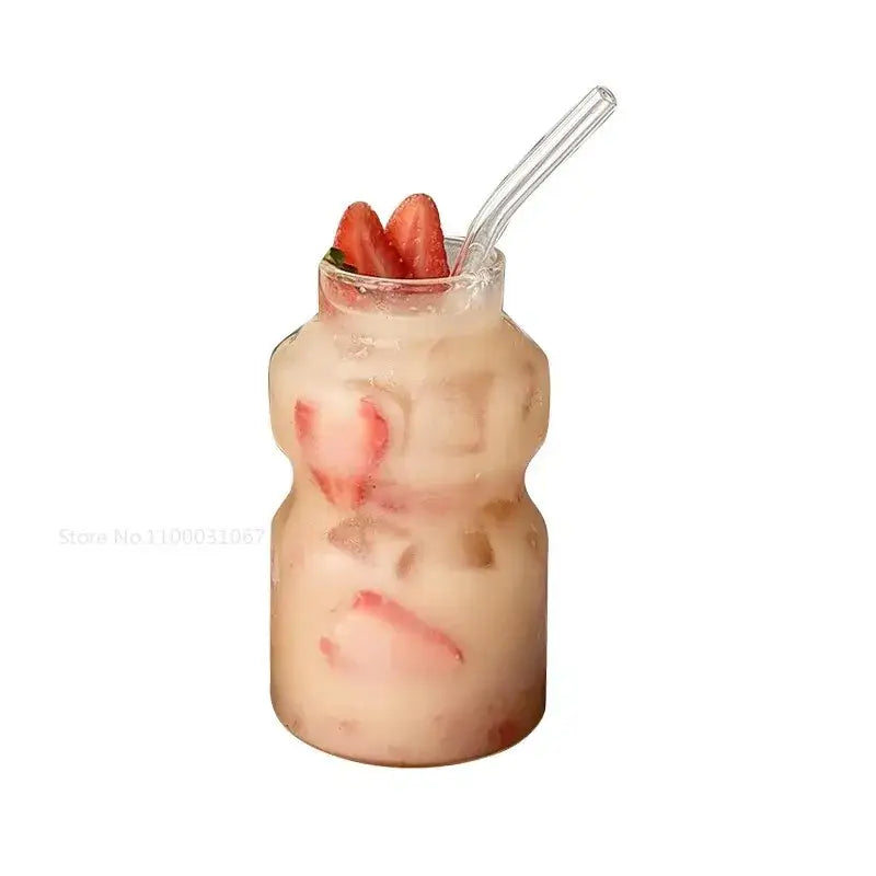 Clear glass ribbed frosted borosilicate glass cups filled with iced strawberry beverage garnished with fresh strawberries