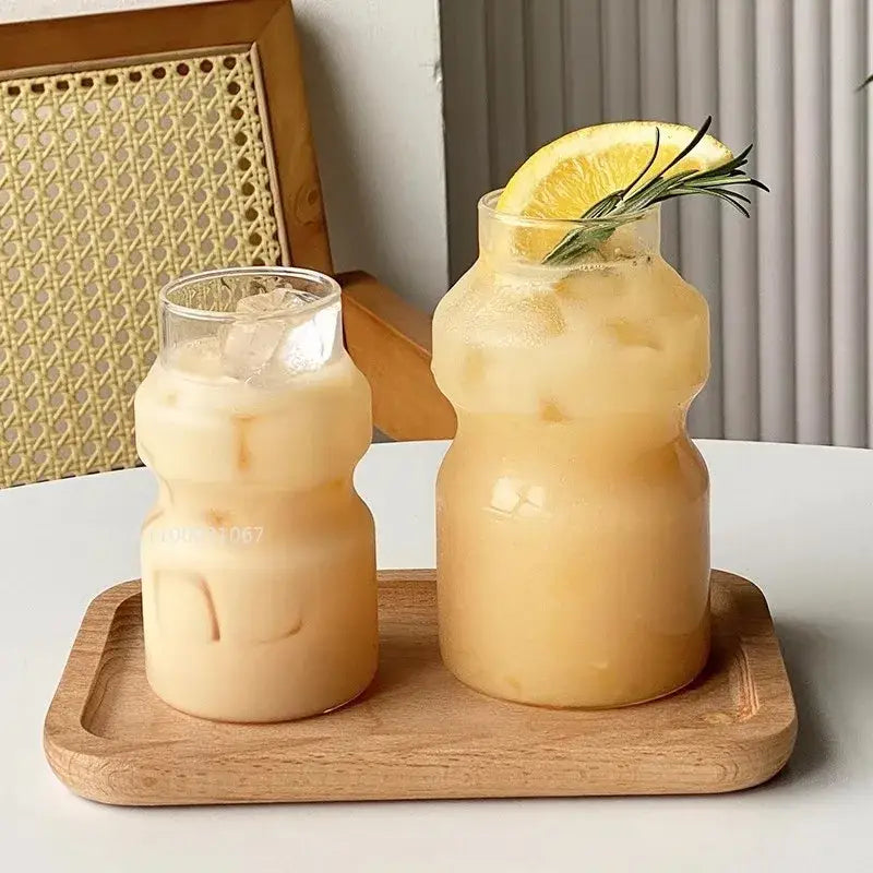 Two clear ribbed frosted borosilicate glass cups filled with iced beverages for kitchen use from decorbites