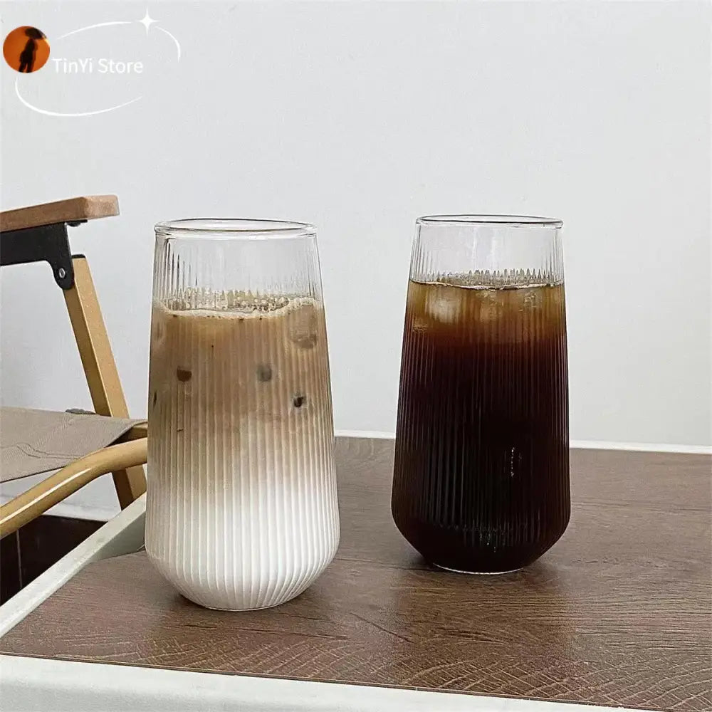 Two tall ribbed glass cups with frosted white lower half and clear upper half from decorbites clear glass coffee set