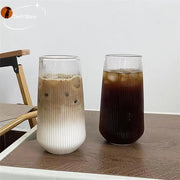 Two tall ribbed glass cups with frosted white lower half and clear upper half from decorbites clear glass coffee set