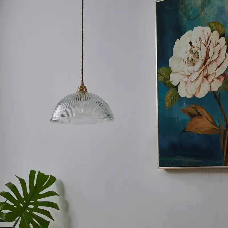 Clear glass chandelier pendant light with brass finish and ribbed textured shade for bedroom pendant lights