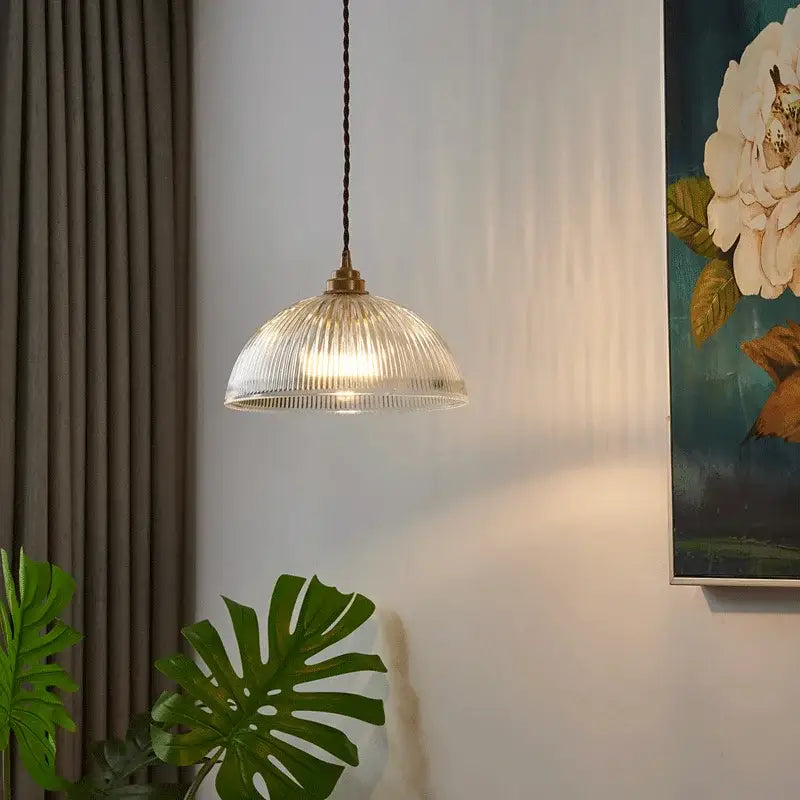 Clear ribbed glass chandelier pendant lights with brass finish and black braided cord for bedroom pendant lights