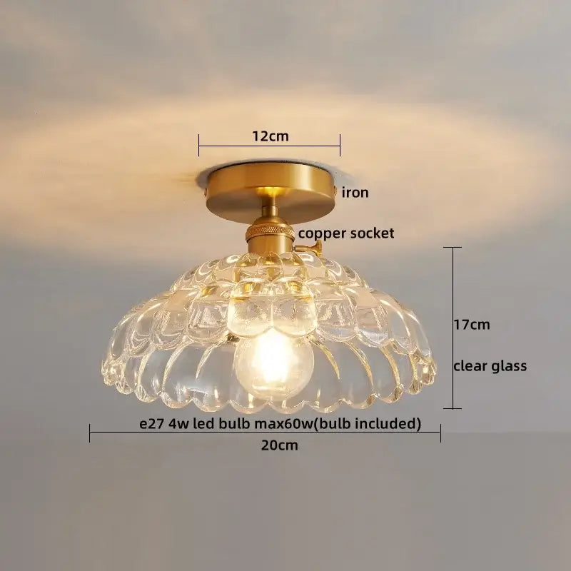 A clear glass copper led ceiling light with brass iron base and scalloped design for dining room chandelier