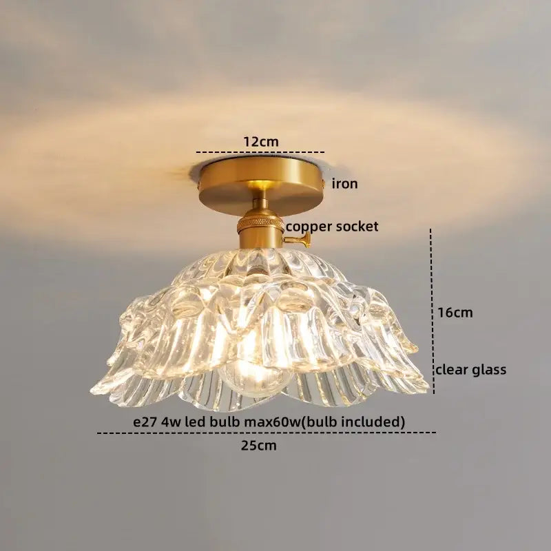 A clear glass copper led ceiling light with ribbed fluted design and brass iron mounting for dining room chandelier