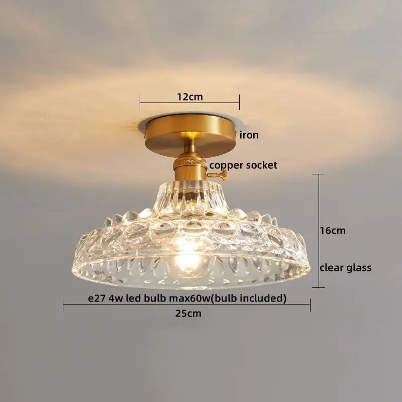 Clear glass pendant ceiling light with brass iron base and copper led socket featuring intricate ribbed texture for dining room
