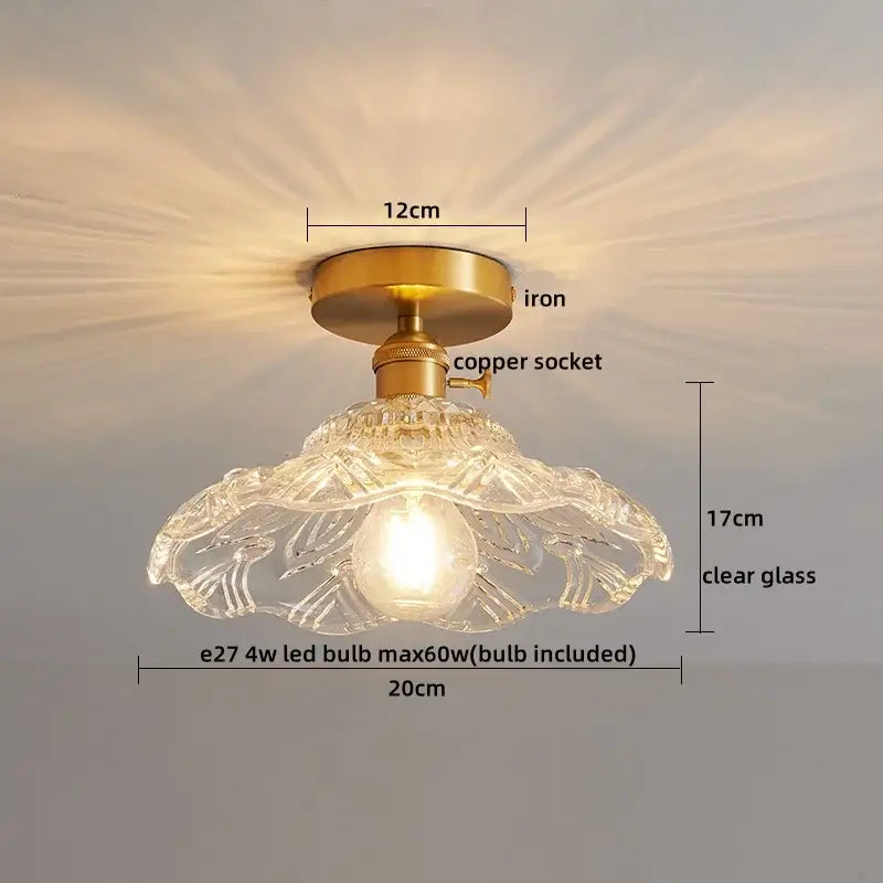 A delicate clear glass copper led ceiling light with floral etchings and brass iron base for dining room chandelier