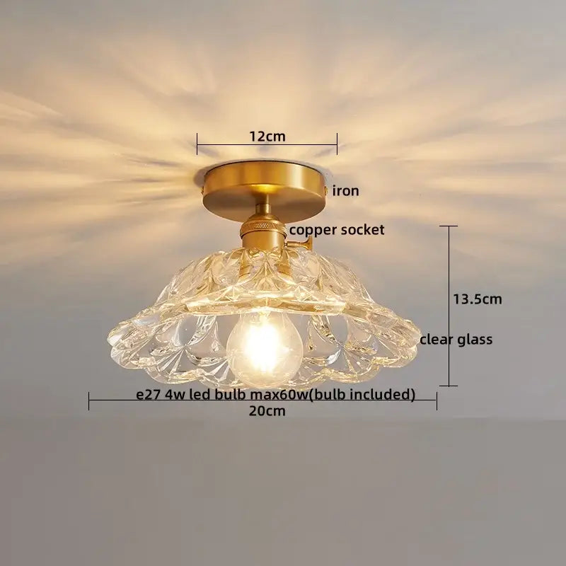 A delicate glass copper led ceiling light with ribbed clear glass pendant, brass iron base, and copper socket for dining room