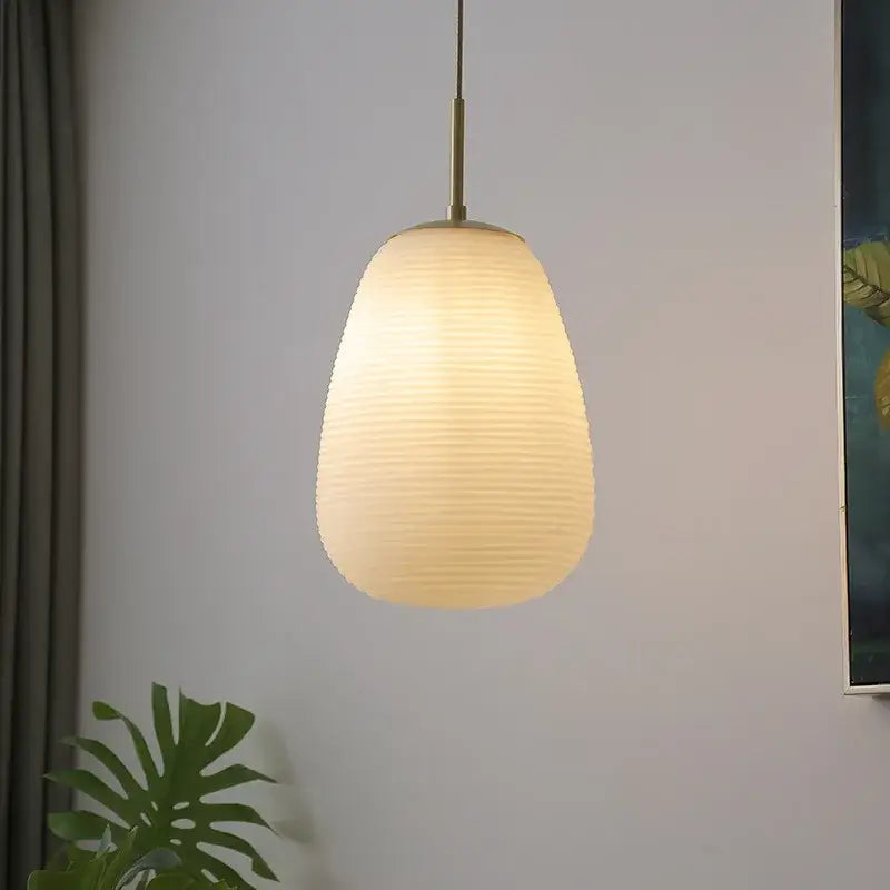 Warm-toned ribbed glass copper led pendant chandelier with brass fixture ideal for dining room lighting