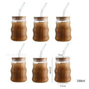 Ribbed glass cup set with clear tumblers featuring bamboo-patterned ridges wooden lids and clear curved straws for dining room