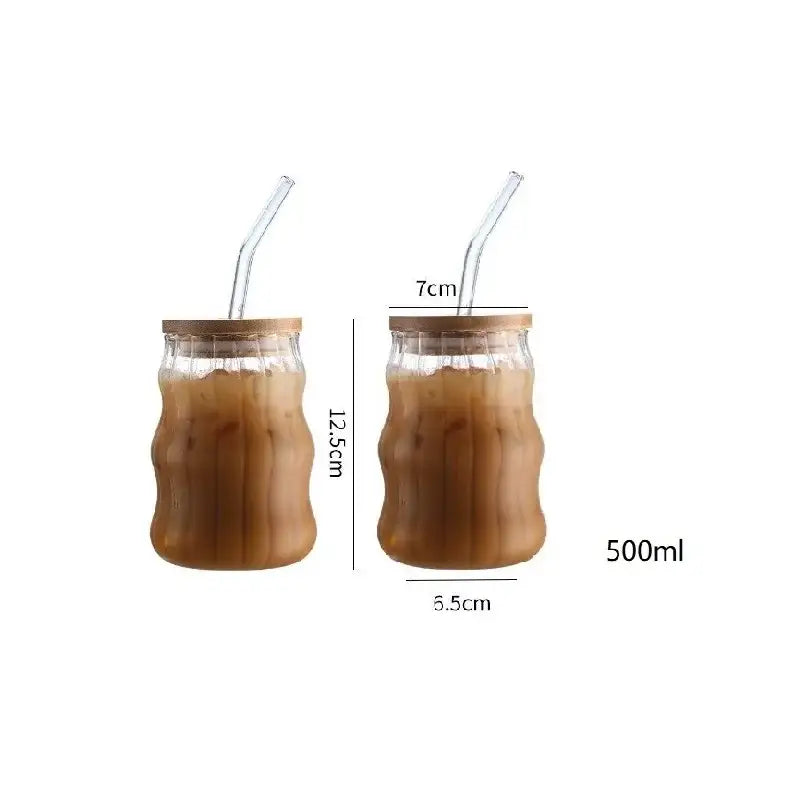 Clear glass cup with bamboo lid and straw filled with iced coffee from decorbites ribbed glass cup set for dining room