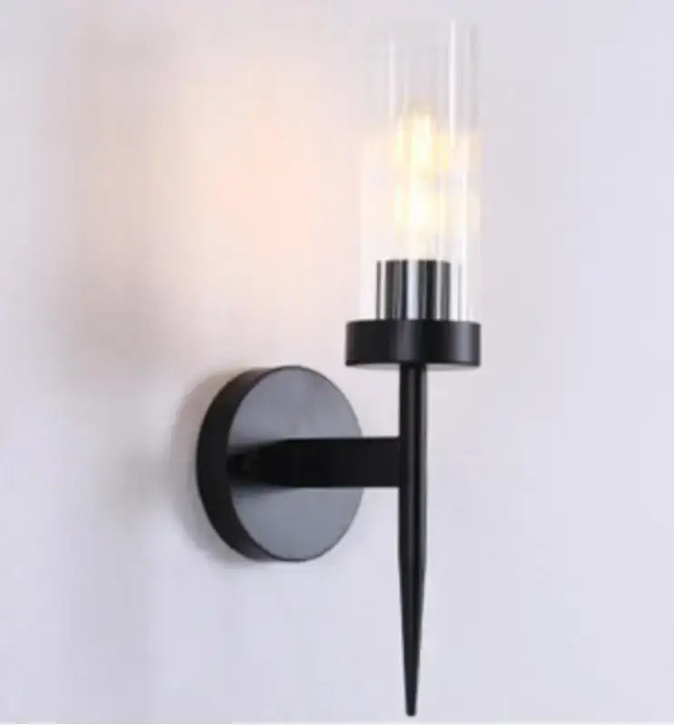 Black metal wall lights with clear ribbed glass cylinder and decorbites gold led bulb for bedroom decorbites gold led