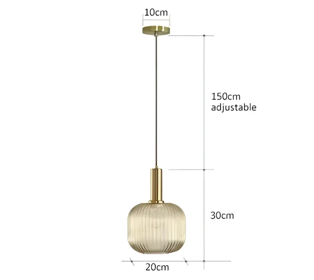 A modern ribbed glass pendant light with a gold-toned metal fixture and textured amber shade for dining rooms